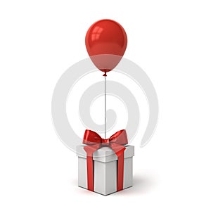 Red glossy balloon tied to gift box or present box with red ribbon bow isolated over white background