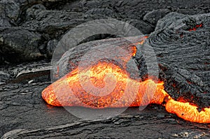 Red glowing lava flow on Hawaii