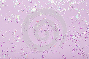 Red glowing mica sparkles on violet pastel trendy abstract background