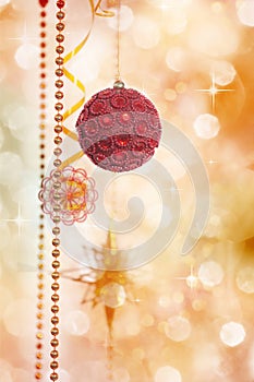 Red and Gold Christmas Decoration on Defocused Lights Background