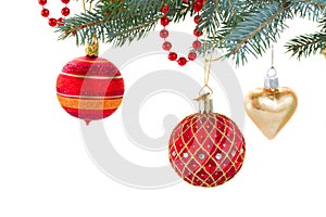 Red and gold christmas decorations on fir tree