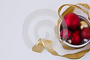 Red & Gold Christmas Ornaments Wrapped in Gold Ribbon