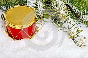 Red and gold drum in snow