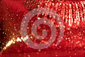 Red with gold festive background. Bokeh from light . Futuristic glittering in space.