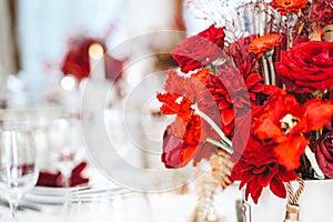Red gold golden color decor, floral arrangement. Festive bouquet, table decoration. Traditional Chinese New Year party