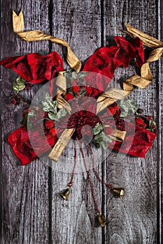 Red, golden Christmas decor with bow and bells