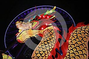 Red and golden dragon in front of Hong Kong Observation Wheel