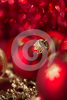 Red and golden xmas ornaments on bright bokeh background