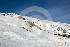 Red gondolas in ski resort Serfaus Fiss Ladis in Austria with sn