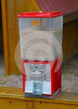 Red Grain dispenser for hand feeding