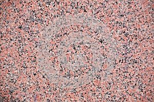Red granite texture with feldspar, quartz, and mica