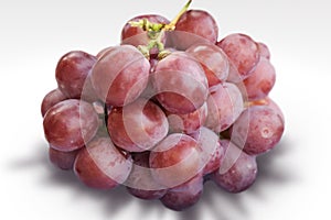 Red grape on white