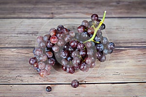 Red grape on wooden table - Bunch of grapes juicy fruit