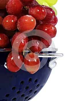 Red Grapes in Blue Colander