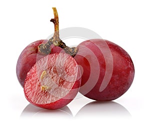 Red grapes and half grape on white background