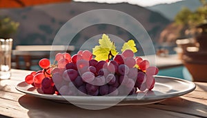 Red grapes on a plate in a sunnny cafe outdoors