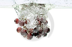 Red Grapes Splashing Into Water photo