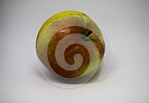 A red and green apple with no background