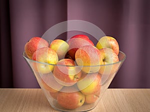 Red green apples in a glass bowl