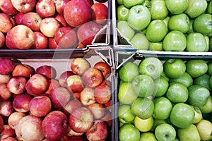 Red and green apples on  shop window close-up