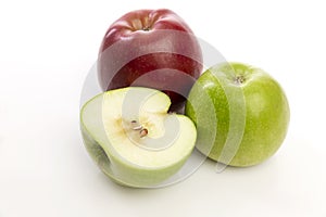 Red and green apples on a white background. Healthy and tasty vegetarian food