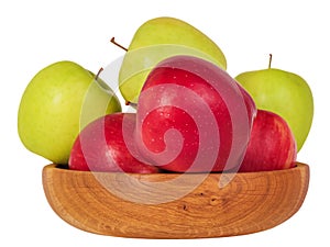 Red and green apples in a wooden bowl isolate on white. Healthy food, apples