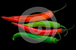 Red and Green Big Chilli peppers Isolated on black