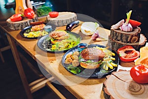 Red, green,black mini burgers with quinoa and vegetables.