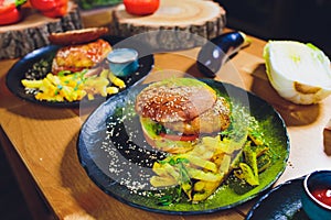 Red, green,black mini burgers with quinoa and vegetables.