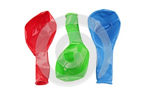Red Green and Blue Deflated Balloons photo