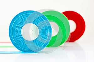 Red Green Blue ribbon Roll isolated , Select focus on blue