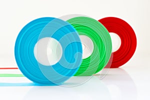 Red Green Blue ribbon Roll isolated , Select focus on green