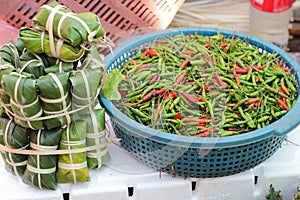 Red and green chili pepper sold in a food street market