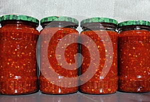 Red and green chilli peppers sauce preserved in vinegar