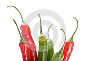 Red and green chilly peppers on white background