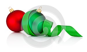 Red and green Christmas baubles with ribbon isolated on white photo