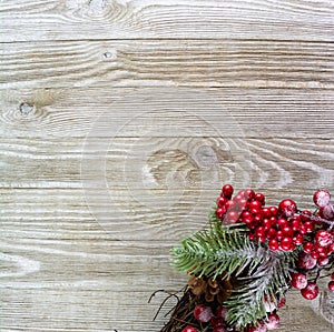 Red and green christmas decoration on lower right side of wooden background