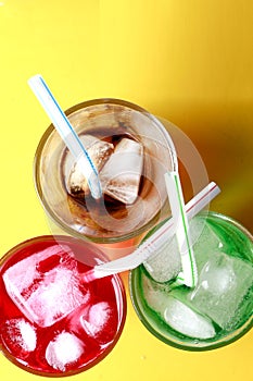 Red, green and cola soda fizzy drinks