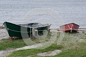 Red And Green Fishing Boats Tied Off With Rope