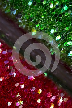 Red and green glitter on glass tubes