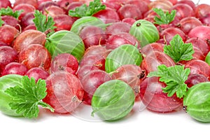 Red and green gooseberries with leaves isolated on white background