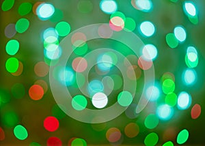 Red and green holiday bokeh. Abstract Christmas background