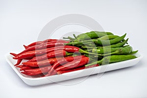 Red and green hot chili peppers isolated on white background.