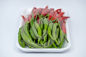 Red and green hot chili peppers isolated on white background.