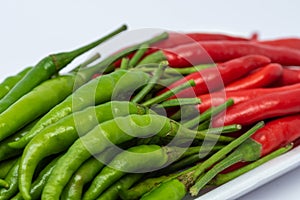 Red and green hot chili peppers isolated on white background.