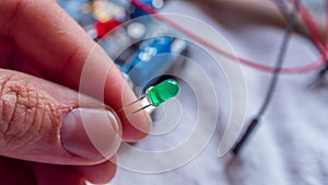 Red and green LED lights being shown in use as part of a microcontroller build