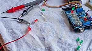 Red and green LED lights being shown in use as part of a microcontroller build