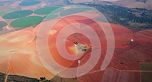 Red and green luminous circular formations of field and meadow landscapes in Brasilia