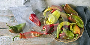 Red and green peppers, on wooden background