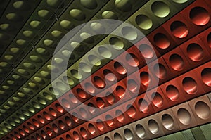 Red, green, silver wall in Prague metro station